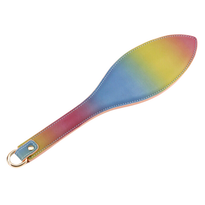 Rainbow bondage paddle made of faux leather for spanking and impact play. Keywords: Spectra Bondage Paddle Rainbow, rainbow BDSM paddle, faux leather spanking paddle, NS Novelties paddle, impact play toy, colorful bondage paddle, rainbow fetish gear, spanking paddle for couples, BDSM impact toys, vibrant paddle for kink play.