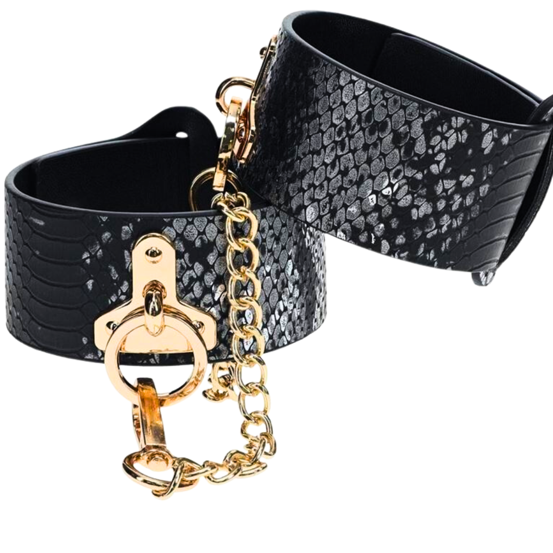 The Florence Iridescent Snake BDSM Ankle Cuffs by Ouch! feature bonded leather, gold-tone hardware, and adjustable straps for stylish and functional restraint.