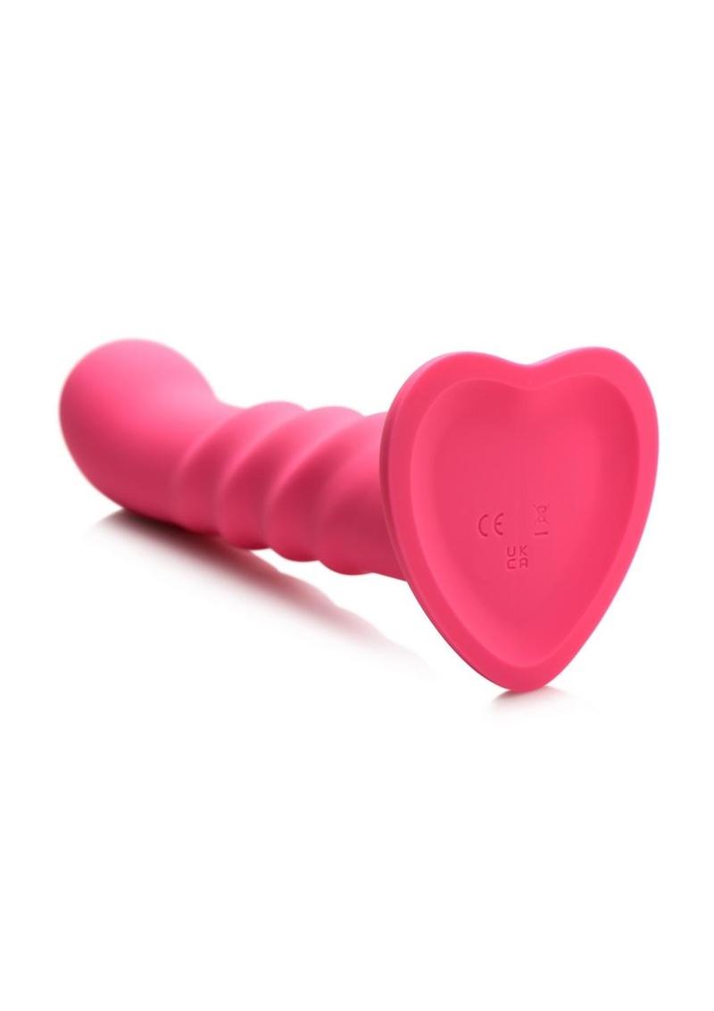 Enhance your playtime with the Simply Sweet Ribbed Dildo, featuring three textured ribs, 3 speeds and 7 patterns of vibration, and a remote control for effortless pleasure. Pink ribbed silicone dildo with vibrations, remote-controlled, harness-compatible suction base, waterproof, body-safe, phthalate-free. Keywords: pink silicone vibrating dildo, ribbed silicone dildo, G-spot vibrator, P-spot vibrator, harness-compatible dildo, suction cup dildo, waterproof vibrating dildo, remote-controlled sex toy, rechar