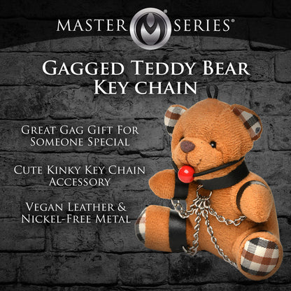 Burnt orange teddy bear keychain with cuffs, chains, and a ball gag, perfect as a gag gift or fun accessory.

gagged teddy bear keychain, BDSM bear keychain, gag gift kinky bear, bondage bear accessory, gagged teddy bag charm, quirky gag gifts, BDSM flagging keychain, teddy bear bondage toy, kinky novelty bear, bondage-themed accessories