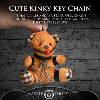 Burnt orange teddy bear keychain with cuffs, chains, and a ball gag, perfect as a gag gift or fun accessory.

gagged teddy bear keychain, BDSM bear keychain, gag gift kinky bear, bondage bear accessory, gagged teddy bag charm, quirky gag gifts, BDSM flagging keychain, teddy bear bondage toy, kinky novelty bear, bondage-themed accessories