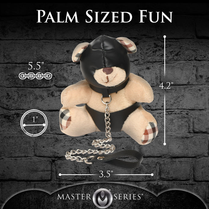 Light peach teddy bear keychain with hood, leather-look panties, and a chain leash, ideal as a gag gift or fun accessory.

hooded teddy bear keychain, BDSM bear keychain, gimp bear gift, bondage teddy bear keychain, kinky gag gifts, leather teddy keychain, teddy bear with chain leash, novelty bear keychain, gimp-themed teddy bear accessory, cheeky bondage gift.