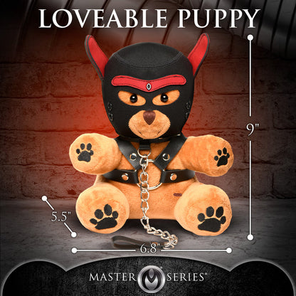 Light peach bondage teddy bear with faux leather harness, mini flogger, and removable eye mask—playful and cuddly with a BDSM aesthetic.

