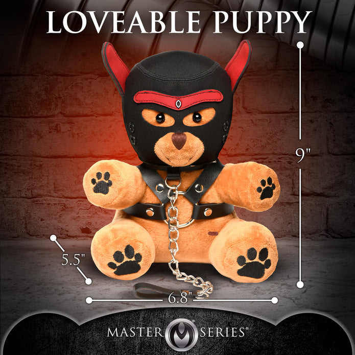 Light peach bondage teddy bear with faux leather harness, mini flogger, and removable eye mask—playful and cuddly with a BDSM aesthetic.

