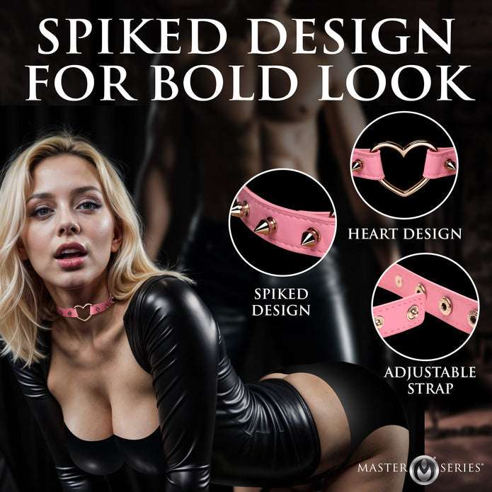 Spiked vegan leather collar with heart accent, adjustable snaps, and nickel-free hardware, available in light pink or black.