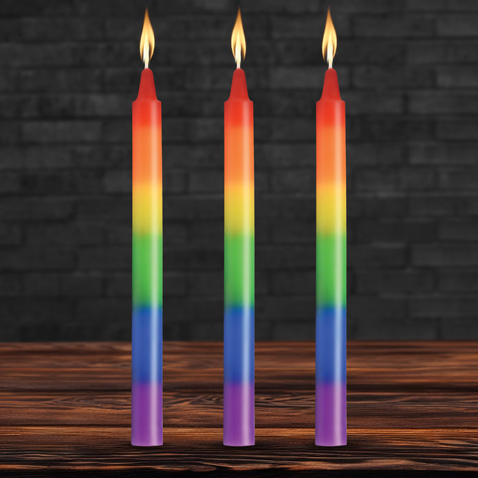 Set of three unscented rainbow drip candles designed for wax play, featuring vibrant layers of color for temperature sensation and artistic body art.

