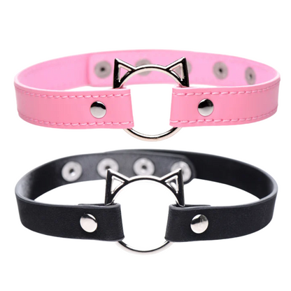 Kitty play choker in pink or black, with cat-shaped O-ring, adjustable snap buttons, and lightweight PU leather design for stylish, comfortable wear.

