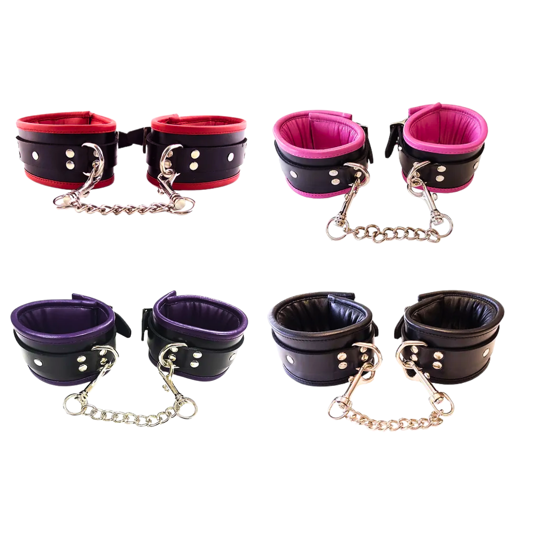 leather padded wrist cuffs, adjustable wrist cuffs, luxury BDSM cuffs, detachable chain cuffs, D-ring leather cuffs, lockable wrist cuffs, beginner BDSM cuffs, advanced bondage cuffs, black leather cuffs, pink leather cuffs, purple leather cuffs, red leather cuffs, comfortable wrist restraints, soft leather bondage cuffs, padlock-compatible wrist cuffs, stylish BDSM accessories