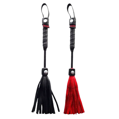 Rouge Mini Leather Flogger, compact BDSM flogger, mini leather flogger, black and red BDSM flogger, beginner-friendly flogger, portable bondage flogger, lightweight BDSM whip, leather tassel flogger, wrist loop flogger, wrapped handle flogger, versatile BDSM accessory, playful bondage flogger, compact BDSM toy, soft leather BDSM whip, stylish flogger for couples, travel-sized flogger, durable leather flogger, Rouge BDSM collection, compact impact play tool, giftable BDSM accessories