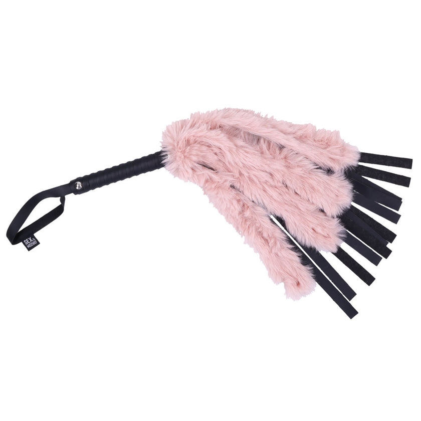 Dual-textured faux fur and vegan leather flogger with rose gold handle, perfect for teasing and impact play, 13" leather falls, and 10.75" fur falls.