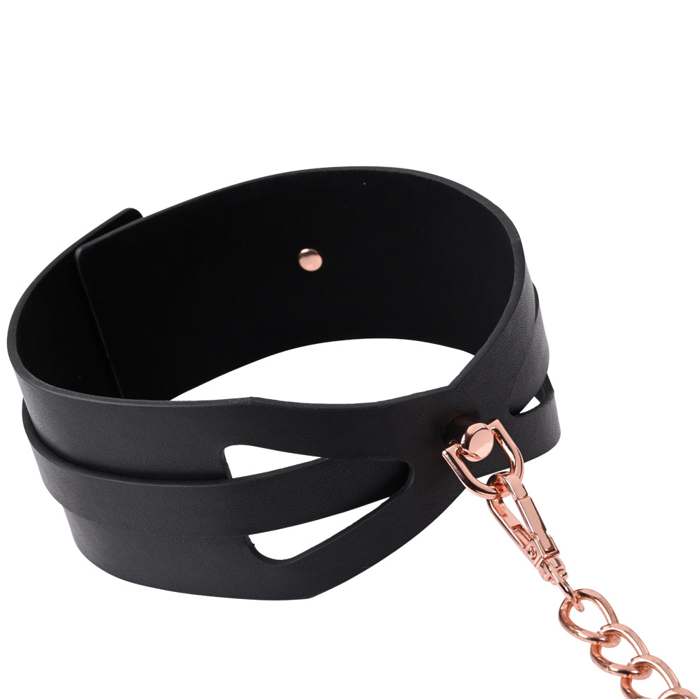 Sex and Mischief S&M Brat Collar and Leash with a faux leather corset-style collar and 30-inch rose gold chain for bondage play.