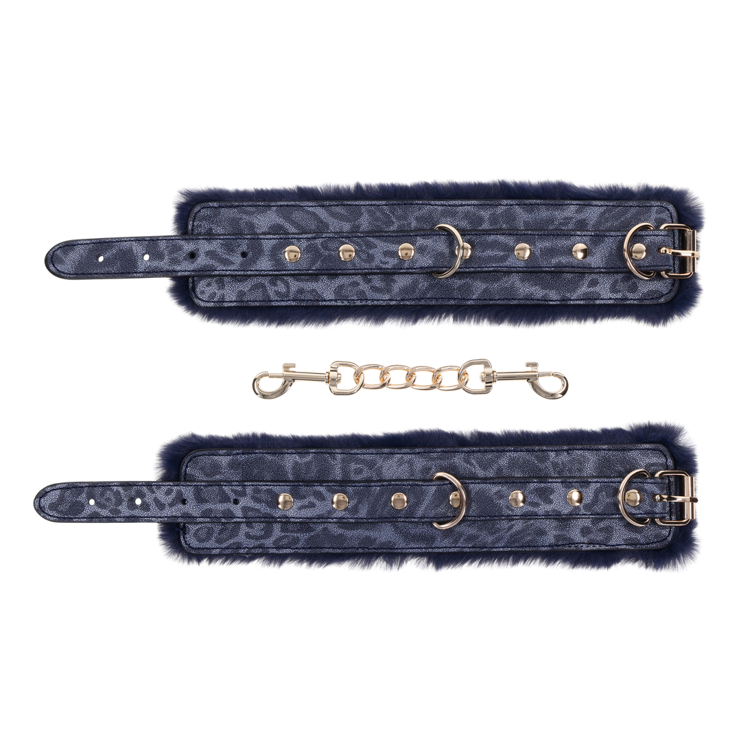 Cougar Fur Handcuffs with soft blue faux fur lining, gold-plated hardware, and adjustable buckle cuffs for elegant bondage play.