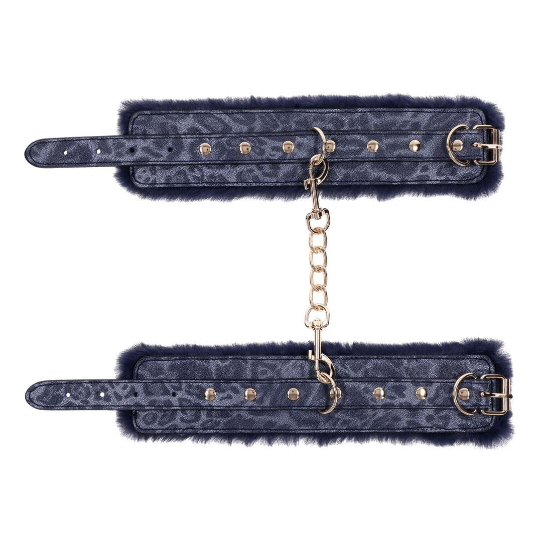 Cougar Fur Handcuffs with soft blue faux fur lining, gold-plated hardware, and adjustable buckle cuffs for elegant bondage play.