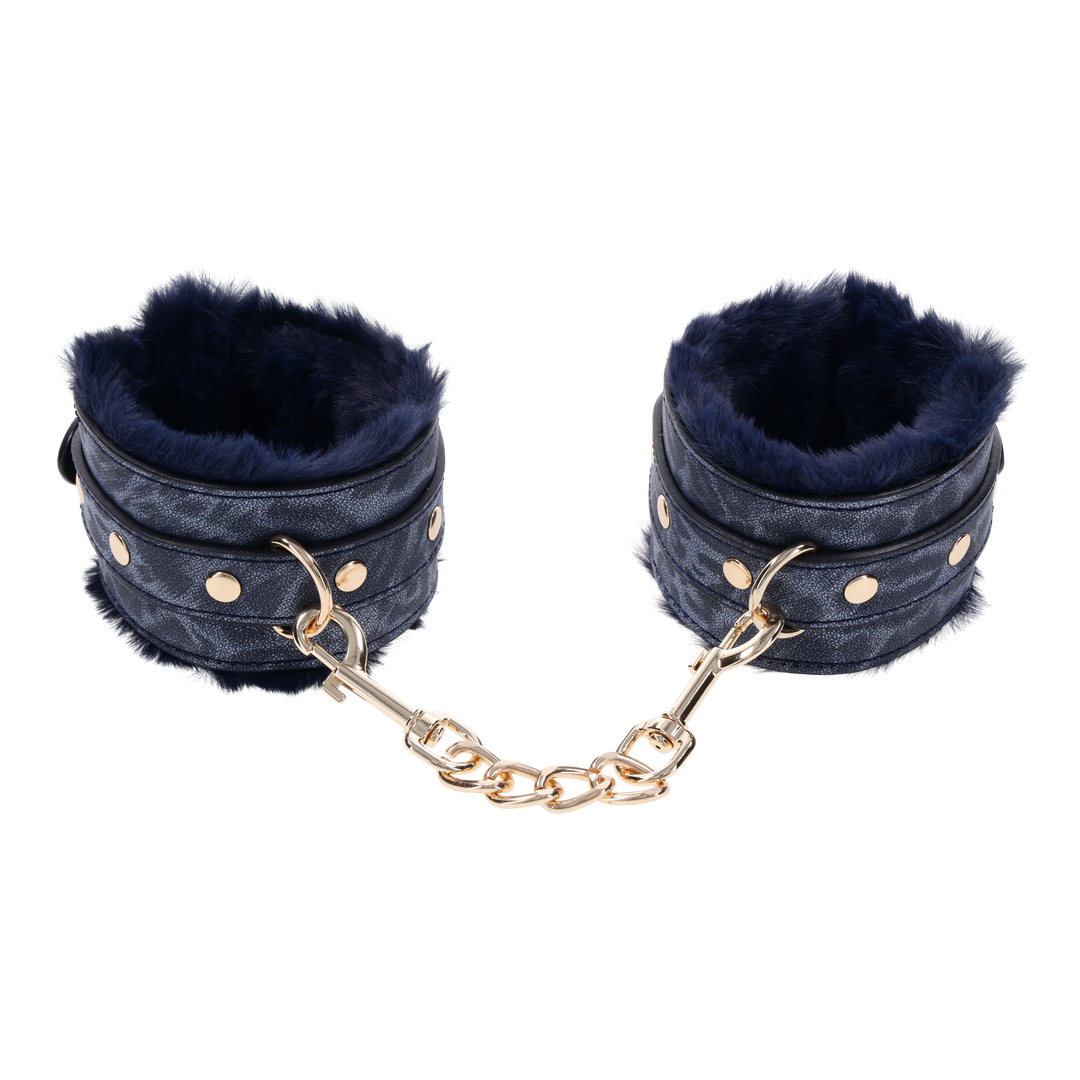 Cougar Fur Handcuffs with soft blue faux fur lining, gold-plated hardware, and adjustable buckle cuffs for elegant bondage play.