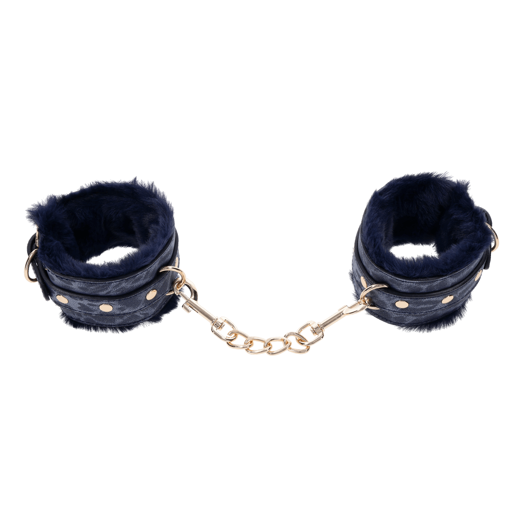 Cougar Fur Handcuffs with soft blue faux fur lining, gold-plated hardware, and adjustable buckle cuffs for elegant bondage play.