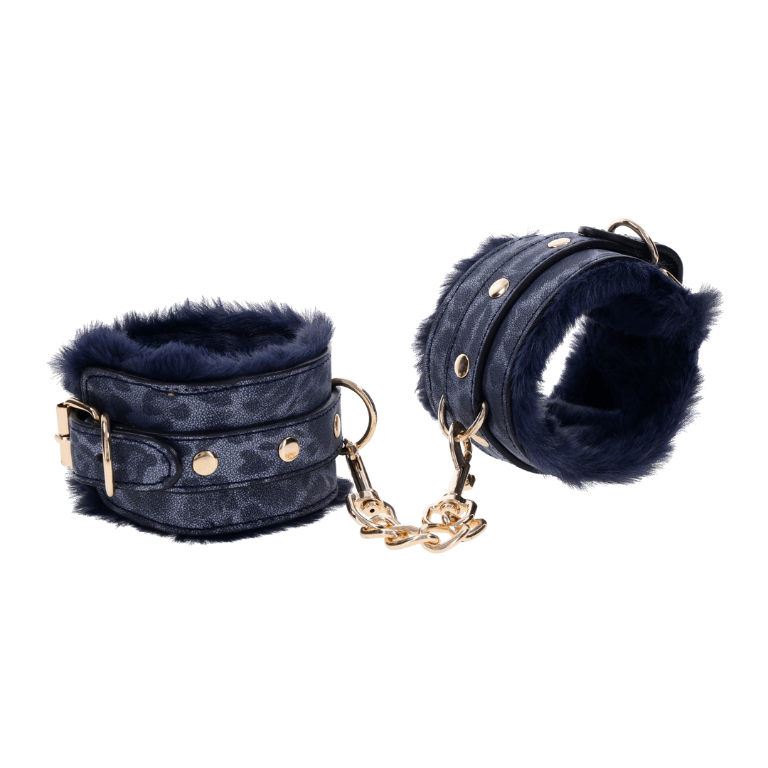 Cougar Fur Handcuffs with soft blue faux fur lining, gold-plated hardware, and adjustable buckle cuffs for elegant bondage play.