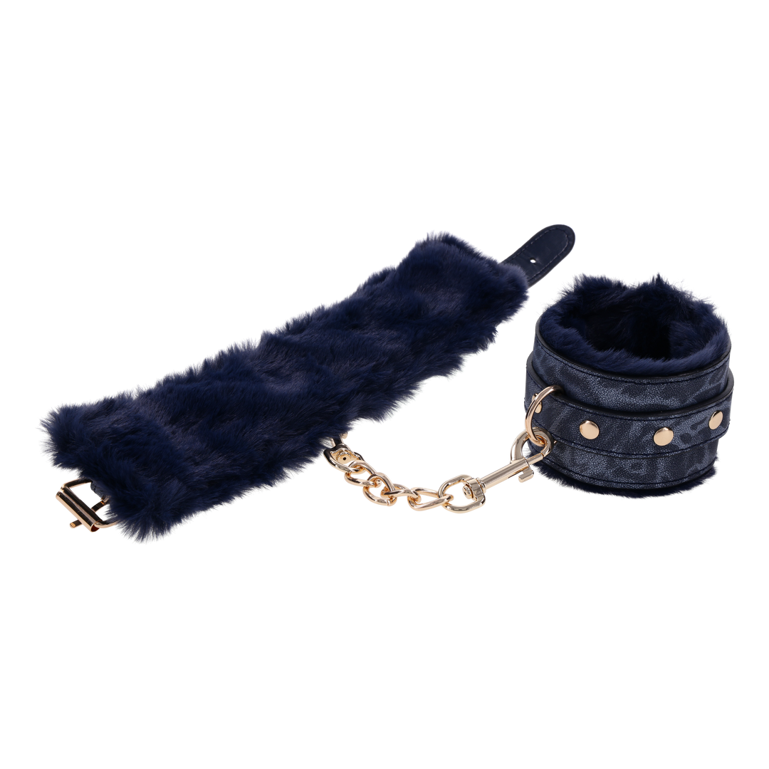 Cougar Fur Handcuffs with soft blue faux fur lining, gold-plated hardware, and adjustable buckle cuffs for elegant bondage play.