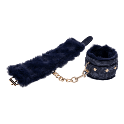 Cougar Fur Handcuffs with soft blue faux fur lining, gold-plated hardware, and adjustable buckle cuffs for elegant bondage play.