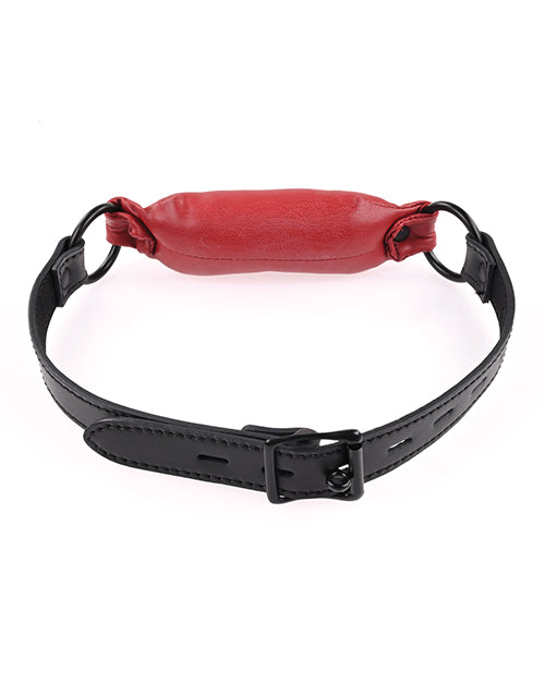 Saffron Soft Bit Gag in red vegan leather with an adjustable buckle, perfect for bondage play. Keywords: Saffron Soft Bit Gag, vegan leather bit gag, red gag for bondage, Sportsheets gag, comfortable bit gag, adjustable bondage gag, BDSM gag, kink accessories, bondage restraints, gags and muzzles.