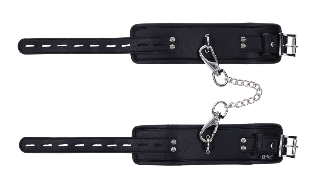 Edge® Handcuffs with padded black design, adjustable buckle closure, and removable metal tether for comfortable and secure BDSM play.