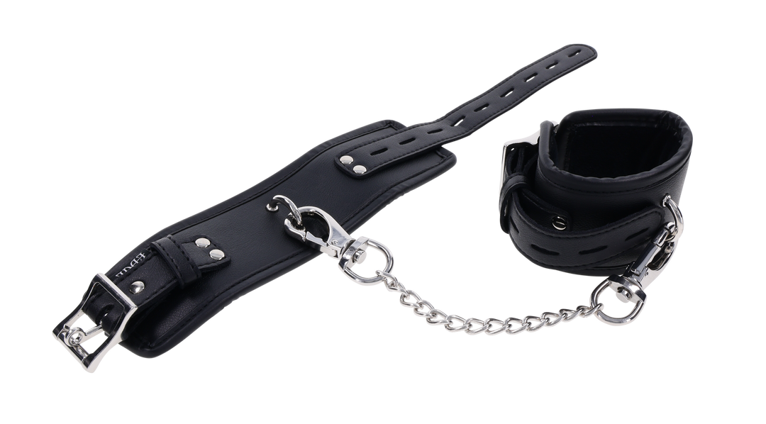 Edge® Handcuffs with padded black design, adjustable buckle closure, and removable metal tether for comfortable and secure BDSM play.