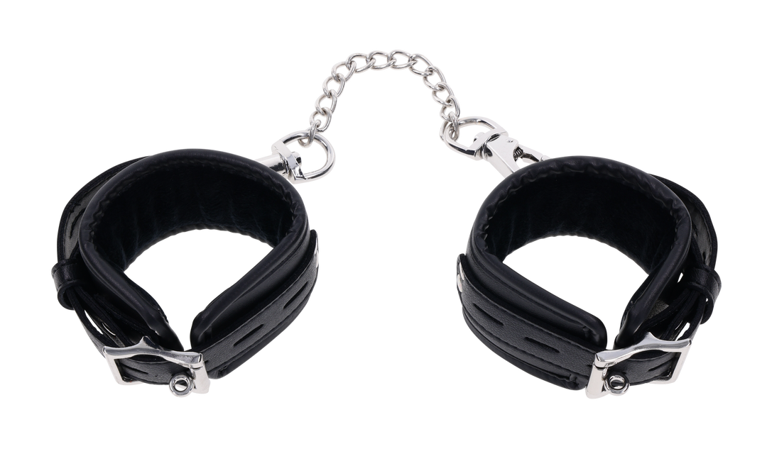 Edge® Handcuffs with padded black design, adjustable buckle closure, and removable metal tether for comfortable and secure BDSM play.