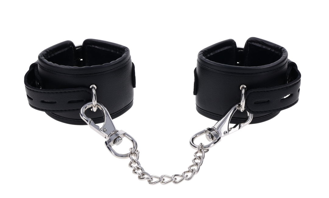 Edge® Handcuffs with padded black design, adjustable buckle closure, and removable metal tether for comfortable and secure BDSM play.