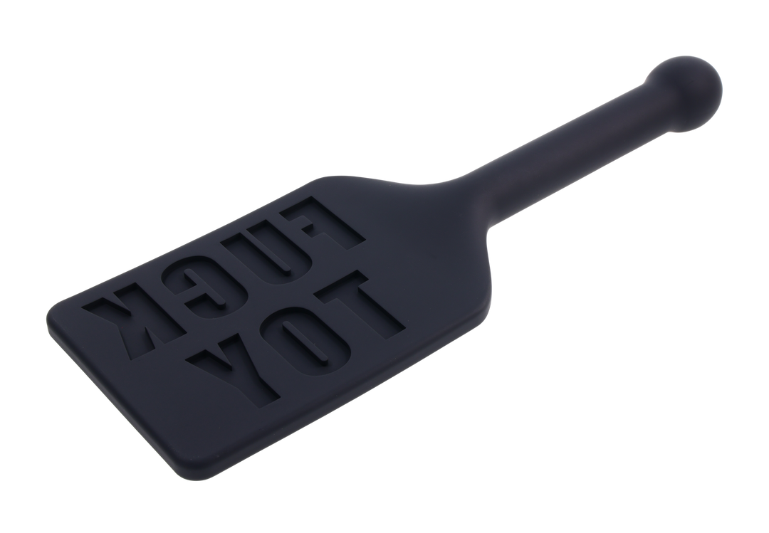 Edge® Silicone Paddle with 'FUCK TOY' imprint, flexible silicone head, and metal-reinforced handle for precision impact play and versatility.