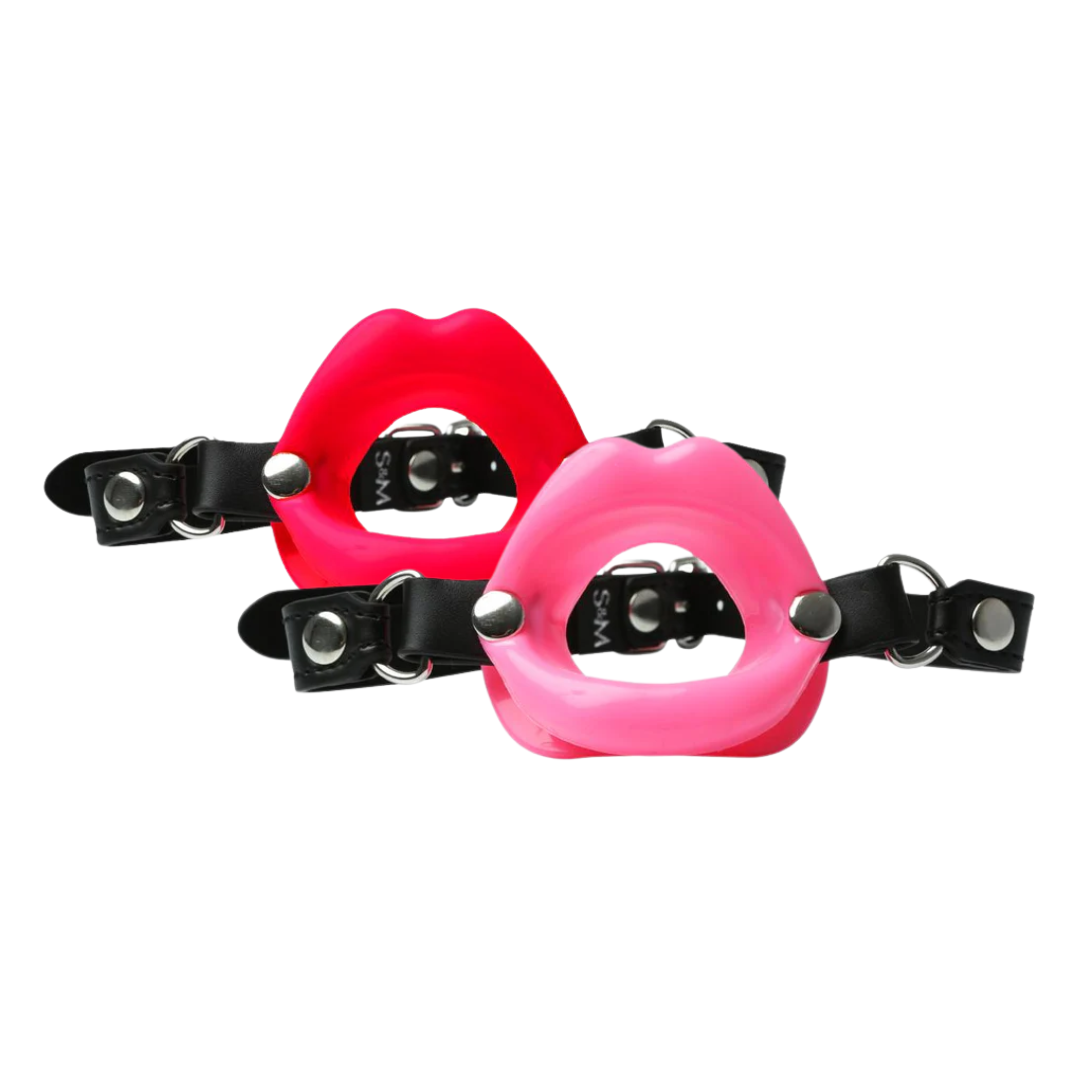 Sex & Mischief Silicone Lips Gag, red silicone lips gag, pink silicone lips gag, open-mouth gag, vegan leather strap gag, adjustable BDSM gag, flirty ball gag, playful restraint gag, nickel-free hardware gag, silicone BDSM gag, beginner bondage gag, unique BDSM accessories, lipstick fantasy gag, Sportsheets lips gag, open-mouth bondage gag, fun BDSM gag, durable silicone gag, stylish BDSM accessory, 25-inch strap gag, buckle closure restraint gag, creative BDSM tool