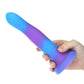 Glow-in-the-dark silicone dildos in vibrant blue, pink, and green colors with a bendable design and strong suction base. Keywords: glow-in-the-dark dildo, bendable silicone dong, vibrant sex toys, strong suction base dildo, harness-compatible toys, premium silicone dildos, rave-themed adult toys, colorful sex toys, party-themed dildos, bonus PowerBullet included.