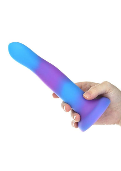 Glow-in-the-dark silicone dildos in vibrant blue, pink, and green colors with a bendable design and strong suction base. Keywords: glow-in-the-dark dildo, bendable silicone dong, vibrant sex toys, strong suction base dildo, harness-compatible toys, premium silicone dildos, rave-themed adult toys, colorful sex toys, party-themed dildos, bonus PowerBullet included.