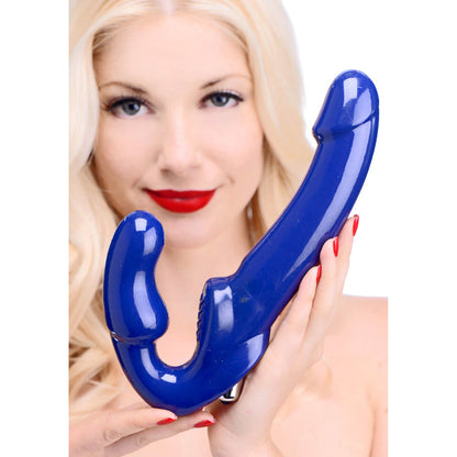 Blue strap-free vibrating strap-on with curved shaft, textured clitoral pad, and waterproof design for simultaneous partner stimulation.

