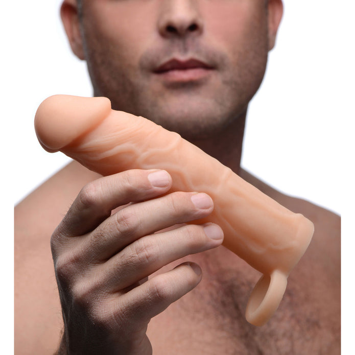 Size Matters Penis Extender Sleeve Silicone - Flesh/Vanilla - 2in  Vanilla silicone penis extender with 2-inch extension, lifelike veins, and scrotum ring for enhanced length, girth, and secure stimulation.

silicone penis extension, Size Matters penis extender, 2-inch penis sleeve, realistic penis extension, lifelike veins extension, girth and length enhancer, scrotum ring extender, vanilla penis enhancer, phthalate-free silicone sleeve, waterproof penis extender