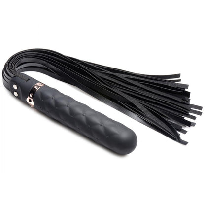 A Vibra-Lasher flogger featuring a black silicone dildo handle with a rose gold accent and durable faux leather falls, designed for vibration and impact play.

