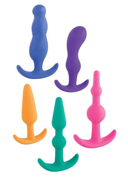 set of five colorful anal plugs in various shapes and sizes, each with an ergonomic design and a flared base for safety. The plugs are shown in blue, pink, teal, yellow, and purple, arranged neatly in a fan-like display.