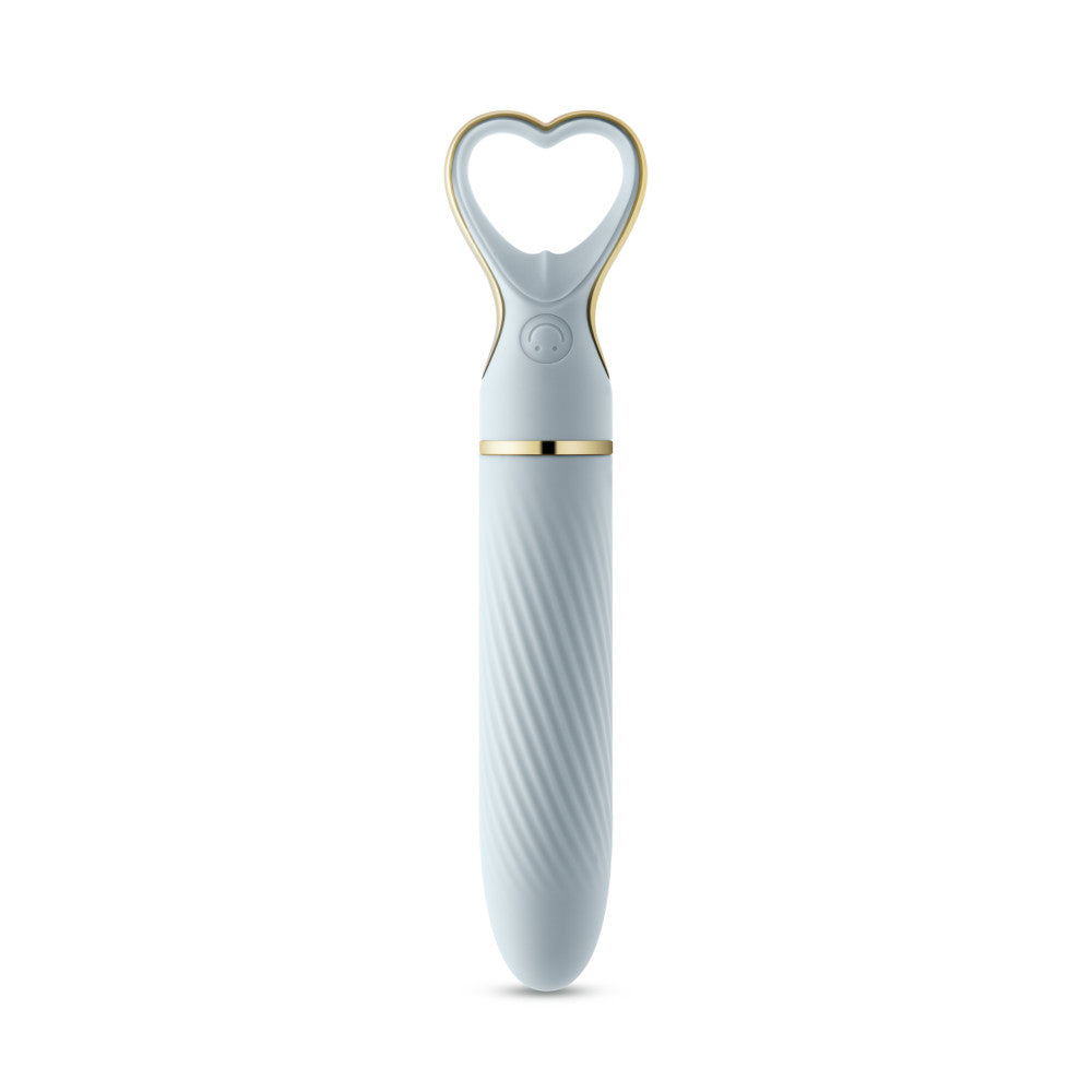 A chic, heart-shaped vibrator with 10 vibration modes, a tapered tip, and a gold-accented handle. Made from soft silicone, it’s splashproof, USB rechargeable, and compact for travel. 
Keywords: Delice vibrator, heart-shaped handle, chic vibrator, Puria silicone, UltraSilk finish, splashproof vibrator, USB rechargeable, travel-friendly vibrator, 10 vibration modes, compact vibrator, body-safe silicone, giftable vibrator