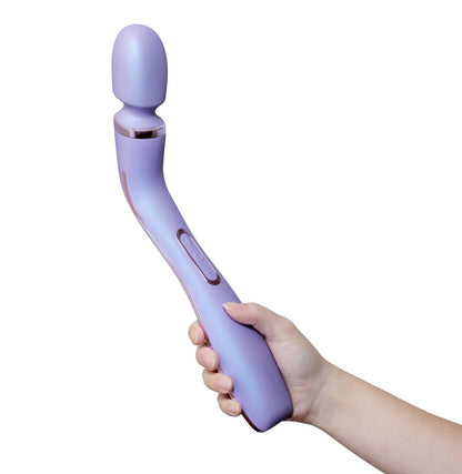 Purple ergonomic massage wand featuring RumbleTech™ vibrations, long handle, and smooth silicone design with a remote control.Keywords: massage wand, RumbleTech wand, ergonomic vibrator, lavender wand, remote control vibrator, waterproof wand, Puria silicone wand, self-care massage wand, rechargeable vibrator, deep tissue massage wand.