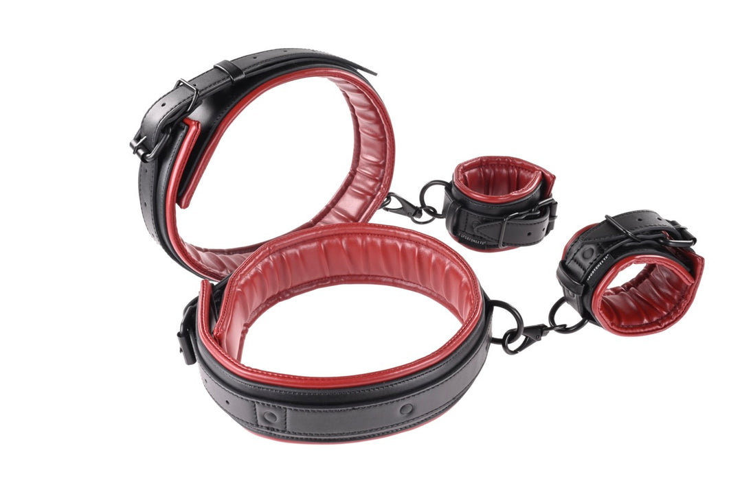 Saffron Thigh and Wrist Cuff Set in black and red faux leather, perfect for versatile restraint play. Keywords: Saffron Thigh and Wrist Cuff Set, faux leather cuffs, adjustable BDSM restraints, thigh and wrist cuffs, bondage restraint set, Sportsheets cuffs, BDSM accessories, kink restraint kit, bondage toys for couples, BDSM positioning restraints.