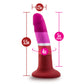 Lesbian pride-colored silicone dildo with a petite design, straight shaft, and suction base, made from smooth Purio™ silicone. Keywords: lesbian pride dildo, Avant dildo, petite dildo, beginner-friendly dildo, suction cup dildo, harness-compatible dildo, body-safe silicone dildo, colorful pride dildo, Purio silicone, artisan-crafted dildo.
