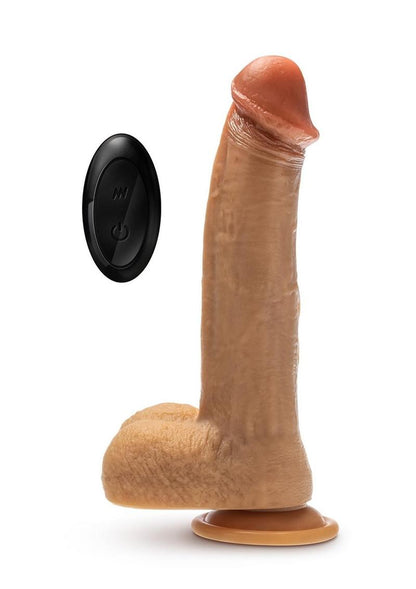 Dr. Phillips 9-inch vibrating & thrusting dildo with remote control, liquid silicone shaft, 9 vibration modes, and 3 thrusting speeds for hands-free fun.

