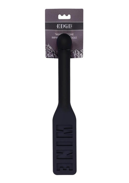 Edge® Silicone Paddle with 'MINE' imprint, flexible silicone head, metal-reinforced handle, and insertable design for BDSM play.