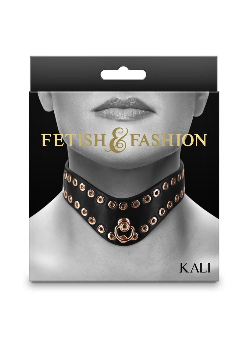 Black BDSM collar with gold-tone studs, adjustable buckle, and D-ring for leash attachment. Keywords: BDSM collar, gold studded collar, adjustable fetish collar, PU leather BDSM collar, vegan BDSM collar, nickel-free collar, BDSM accessories, luxury BDSM gear, Kali collar, black and gold BDSM collar.