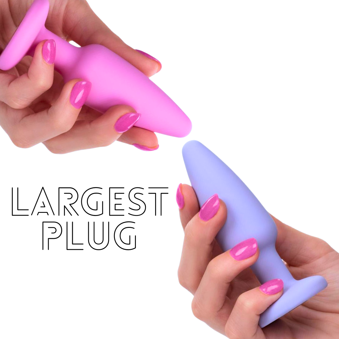 hand holding largest plug in the beginner anal training kit