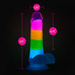 A vibrant glow-in-the-dark rainbow dildo with dual-density silicone, a suction cup base, and lifelike details. Perfect for hands-free or strap-on play. Keywords: Neo Elite Rainbow Rave, glow-in-the-dark dildo, rainbow dildo, Sensa Feel, dual-density silicone, Purio silicone, harness-compatible dildo, suction cup dildo, body-safe silicone, lifelike dildo, beginner-friendly toy 