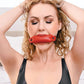 Saffron Soft Bit Gag in red vegan leather with an adjustable buckle, perfect for bondage play. Keywords: Saffron Soft Bit Gag, vegan leather bit gag, red gag for bondage, Sportsheets gag, comfortable bit gag, adjustable bondage gag, BDSM gag, kink accessories, bondage restraints, gags and muzzles.