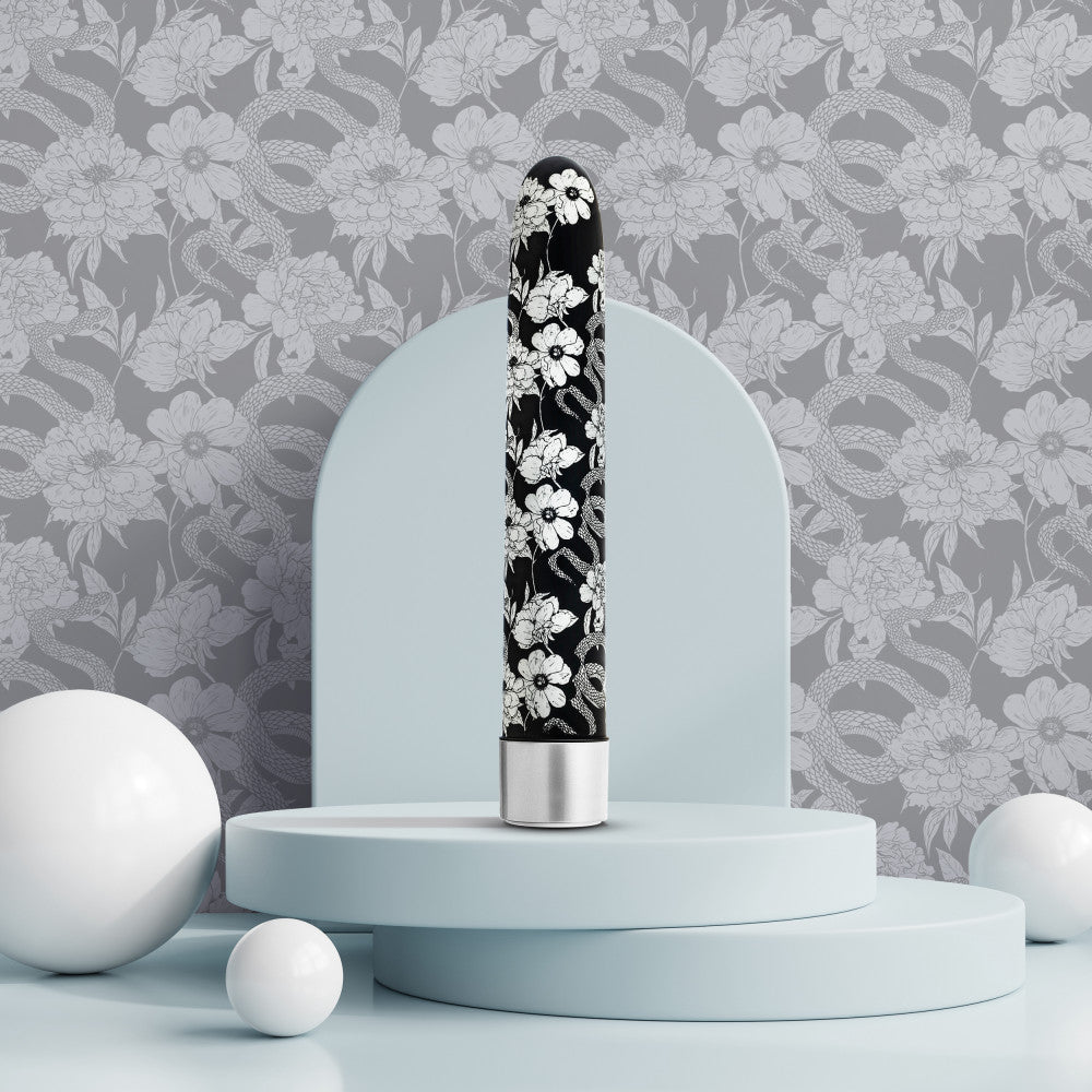 Black slimline vibrator with a white floral pattern, featuring RumbleTech™ vibrations, USB charging, and waterproof functionality.
Keywords: slimline vibrator, floral vibrator, black vibrator, RumbleTech vibrator, USB rechargeable vibrator, waterproof sex toy, elegant vibrator, body-safe sex toy, customizable vibrator, luxury adult toy.