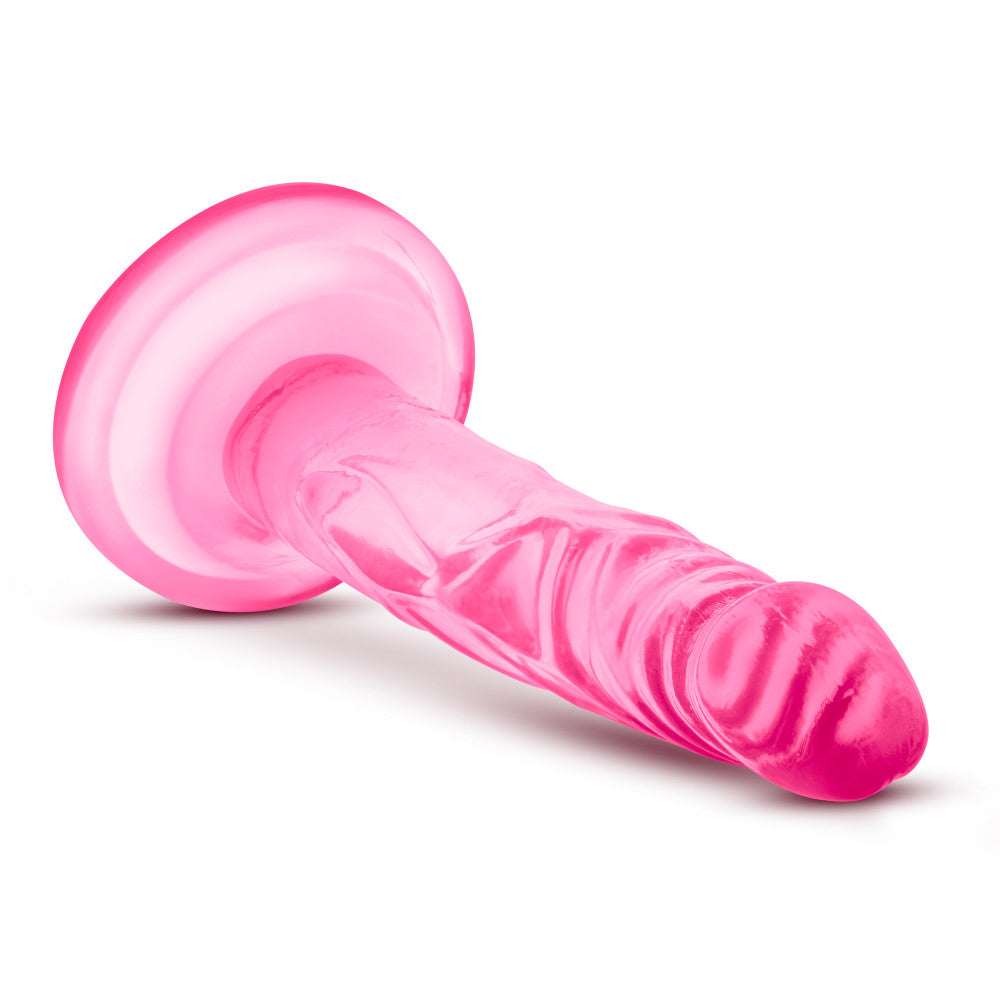 Naturally Yours 5 Inch Mini Cock, slim lifelike dildo with suction cup base and harness compatibility, available in pink or purple.

slim dildo, beginner-friendly dildo, pink dildo, purple dildo, harness-compatible toy, suction cup base, body-safe TPE, pegging dildo, realistic slim dildo, beginner anal toy