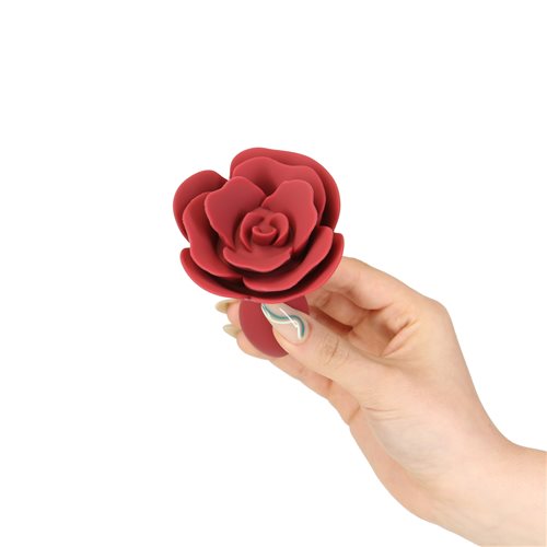 Red silicone anal plug with a rose-shaped base and a sleek, tapered design, perfect for elegant and pleasurable exploration. Keywords: rose anal plug, LUX active Red Rose, silicone anal plug, elegant anal toy, vibrating anal plug, PowerBullet anal plug, body-safe anal toy, tapered anal plug, flexible silicone plug, waterproof anal plug.