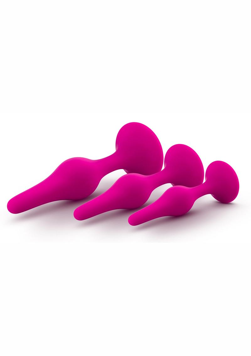 Luxe Beginner Plug Kit in Pink: Satin-smooth silicone, body-safe design, and three graduated sizes make this perfect for anal play beginners. Features tapered tips, suction cup bases, and easy-clean material.