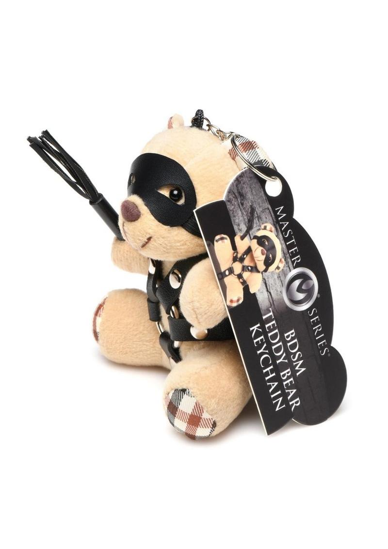 Mini bondage bear with harness, flogger, and removable eye mask for kinky gifting or accessories.

bondage bear keychain, BDSM novelty gift, bondage bear accessory, kinky keychain gift, leather harness bear, mini BDSM bear, bondage-themed gifts, faux leather keychain bear, bondage novelty toys, BDSM flagging accessory